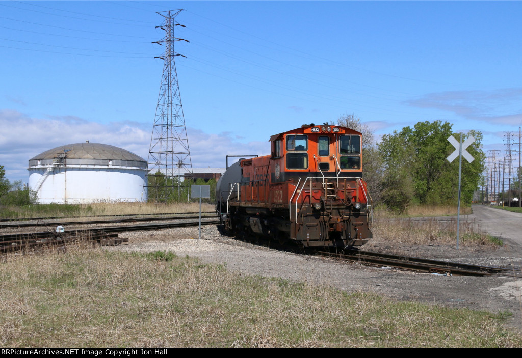 The 114 Job shoves out on to the CN trackage deep in the industrial area of East Chicago